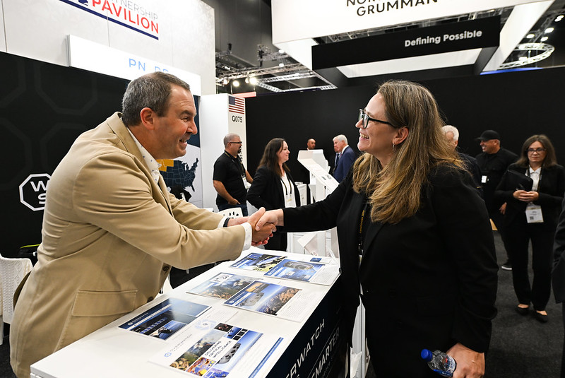 Chargé d’Affaires Erika Olson tours the USA Partnership Pavilion to meet with exhibitors and explore the latest industry innovations.